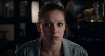 Movie still from “A Date for Mad Mary” (2016), directed by Darren Thornton – A young woman is looking directly at the camera; Close Up shot, Over the shoulder angle