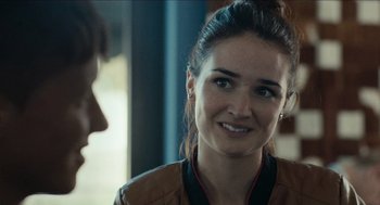 Movie still from “A Date for Mad Mary” (2016), directed by Darren Thornton – A person wearing a leather jacket; Close Up shot, Over the shoulder angle