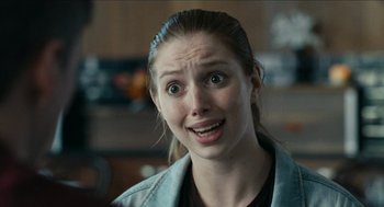 Movie still from “A Date for Mad Mary” (2016), directed by Darren Thornton – A woman with a surprised look on her face; Close Up shot, Over the shoulder angle