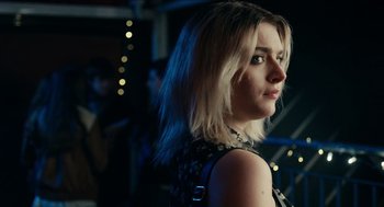 Movie still from “A Date for Mad Mary” (2016), directed by Darren Thornton – A person wearing a dress; Close Up shot, Over the shoulder angle