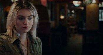 Movie still from “A Date for Mad Mary” (2016), directed by Darren Thornton – A young woman is standing in a room; Close Up shot, Over the shoulder angle