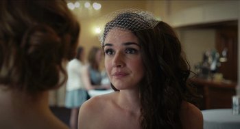 Movie still from “A Date for Mad Mary” (2016), directed by Darren Thornton – A woman wearing a veil looking at the camera; Close Up shot, Over the shoulder angle