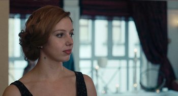 Movie still from “A Date for Mad Mary” (2016), directed by Darren Thornton – A beautiful woman with red hair looking to her left; Close Up shot, Low angle