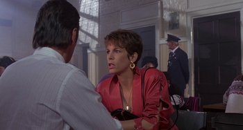 Movie still from “A Fish Called Wanda” (1988), directed by Charles Crichton – A woman talking to a man; Medium shot, Over the shoulder angle