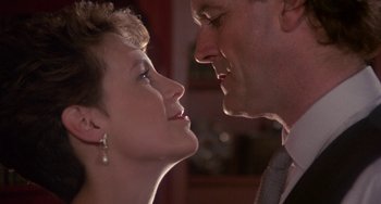 Movie still from “A Fish Called Wanda” (1988), directed by Charles Crichton – Two people looking at each other; Close Up shot, Low angle