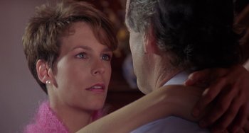 Movie still from “A Fish Called Wanda” (1988), directed by Charles Crichton – A man and a woman looking at one another; Close Up shot, Over the shoulder angle