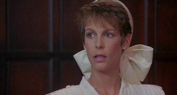 Movie still from “A Fish Called Wanda” (1988), directed by Charles Crichton – A person with short hair; Close Up shot, Low angle