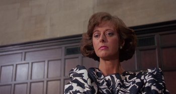 Movie still from “A Fish Called Wanda” (1988), directed by Charles Crichton – A person wearing a dress; Close Up shot, Low angle