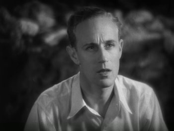 Movie still from “A Free Soul” (1931), directed by Clarence Brown – An old photo of a man in a white dress shirt; Close Up shot, High angle