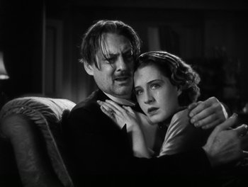 Movie still from “A Free Soul” (1931), directed by Clarence Brown – A black and white photo of a man and a woman embracing; Close Up shot, Low angle