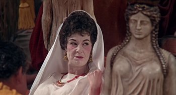 Movie still from “A Funny Thing Happened on the Way to the Forum” (1966), directed by Richard Lester – A woman in a white dress and a white veil; Close Up shot, Low angle