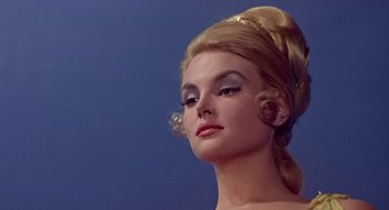 Movie still from “A Funny Thing Happened on the Way to the Forum” (1966), directed by Richard Lester – A person wearing a dress; Close Up shot, Low angle