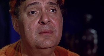 Movie still from “A Funny Thing Happened on the Way to the Forum” (1966), directed by Richard Lester – A man's face with water on his face; Close Up shot, Low angle