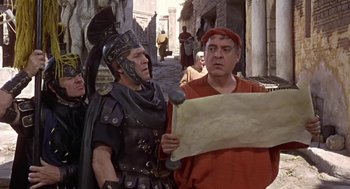 Movie still from “A Funny Thing Happened on the Way to the Forum” (1966), directed by Richard Lester – Two men dressed as roman legionnaires looking at a map; Medium shot, Over the shoulder angle