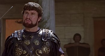 Movie still from “A Funny Thing Happened on the Way to the Forum” (1966), directed by Richard Lester – A man in a roman soldier's outfit with a beard; Close Up shot, Low angle