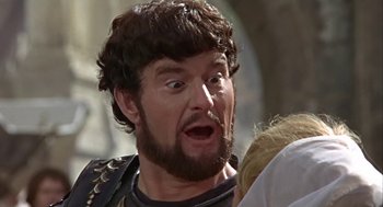 Movie still from “A Funny Thing Happened on the Way to the Forum” (1966), directed by Richard Lester – A person with a beard; Close Up shot, Over the shoulder angle