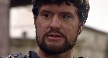 Movie still from “A Funny Thing Happened on the Way to the Forum” (1966), directed by Richard Lester – A person with a beard; Close Up shot, Low angle
