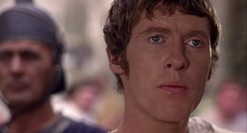 Movie still from “A Funny Thing Happened on the Way to the Forum” (1966), directed by Richard Lester – A man's face as he stares into the distance; Close Up shot, Low angle