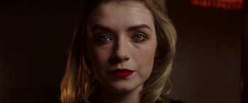 A person wearing a red lipstick