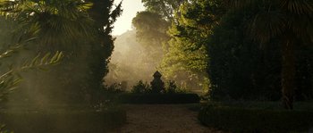 Movie still from “A Good Year” (2006), directed by Ridley Scott – A view of trees and bushes in a garden; Extreme Wide shot, High angle