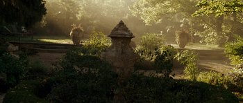 Movie still from “A Good Year” (2006), directed by Ridley Scott – An old fire hydrant in the middle of a garden; Extreme Wide shot, High angle