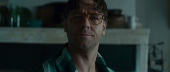 Movie still from “A Good Year” (2006), directed by Ridley Scott – A person wearing glasses; Close Up shot, Low angle