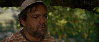 Movie still from “A Good Year” (2006), directed by Ridley Scott – A person wearing a hat; Close Up shot, Over the shoulder angle