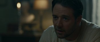 Movie still from “A Good Year” (2006), directed by Ridley Scott – A person wearing a white sweater; Close Up shot, Over the shoulder angle