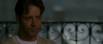 Movie still from “A Good Year” (2006), directed by Ridley Scott – A person wearing a white sweater; Close Up shot, Over the shoulder angle