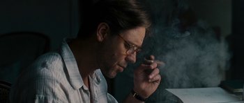 Movie still from “A Good Year” (2006), directed by Ridley Scott – A person smoking a cigarette; Close Up shot, Low angle