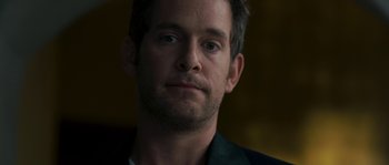 Movie still from “A Good Year” (2006), directed by Ridley Scott – A person wearing a jacket; Close Up shot, Over the shoulder angle