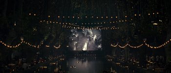 Movie still from “A Good Year” (2006), directed by Ridley Scott – A screen showing a scene of a wedding; Extreme Wide shot, High angle