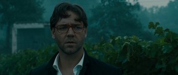 Movie still from “A Good Year” (2006), directed by Ridley Scott – A person wearing glasses and a jacket; Close Up shot, Low angle