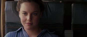 Movie still from “A Good Year” (2006), directed by Ridley Scott – A person sitting in a chair; Close Up shot, Over the shoulder angle