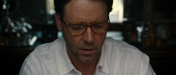 Movie still from “A Good Year” (2006), directed by Ridley Scott – A person wearing glasses and a white shirt; Close Up shot, Over the shoulder angle