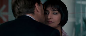 Movie still from “A Good Year” (2006), directed by Ridley Scott – A man and a woman are looking at each other; Close Up shot, Over the shoulder angle