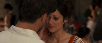 Movie still from “A Good Year” (2006), directed by Ridley Scott – A man and a woman looking into each others eyes; Close Up shot, Over the shoulder angle
