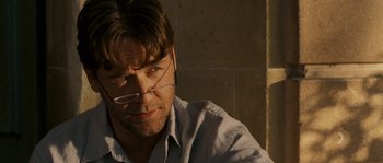 Movie still from “A Good Year” (2006), directed by Ridley Scott – A person wearing glasses and a white shirt; Close Up shot, Over the shoulder angle