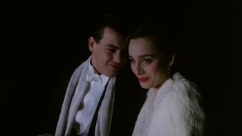 Movie still from “A Handful of Dust” (1988), directed by Charles Sturridge – A man and a woman posing for a picture; Close Up shot, Low angle