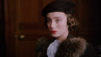 Movie still from “A Handful of Dust” (1988), directed by Charles Sturridge – A person wearing a hat; Close Up shot, Over the shoulder angle