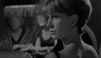 Movie still from “A Hard Day's Night” (1964), directed by Richard Lester – A black - and - white photo of a woman looking at the camera; Close Up shot, Low angle