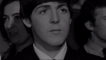 Movie still from “A Hard Day's Night” (1964), directed by Richard Lester – A person wearing a suit and tie; Close Up shot, High angle