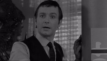 Movie still from “A Hard Day's Night” (1964), directed by Richard Lester – A black and white photo of a man in a vest and tie; Close Up shot, Over the shoulder angle
