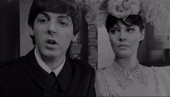 Movie still from “A Hard Day's Night” (1964), directed by Richard Lester – A man and a woman standing next to each other in front of a brick wall; Close Up shot, Over the shoulder angle
