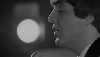 Movie still from “A Hard Day's Night” (1964), directed by Richard Lester – A person with a microphone; Close Up shot, Low angle