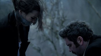 Movie still from “A Horrible Way to Die” (2010), directed by Adam Wingard – A man and a woman standing next to each other; Close Up shot, Over the shoulder angle