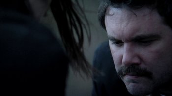 Movie still from “A Horrible Way to Die” (2010), directed by Adam Wingard – A person with a beard; Close Up shot, Over the shoulder angle