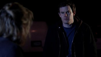 Movie still from “A Horrible Way to Die” (2010), directed by Adam Wingard – A man standing in the dark looking at a woman; Close Up shot, Over the shoulder angle