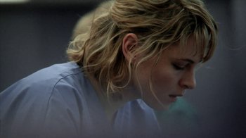 Movie still from “A Horrible Way to Die” (2010), directed by Adam Wingard – A person with long blonde hair; Close Up shot, Over the shoulder angle