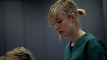 Movie still from “A Horrible Way to Die” (2010), directed by Adam Wingard – A woman with blonde hair is looking down at her face; Close Up shot, Low angle